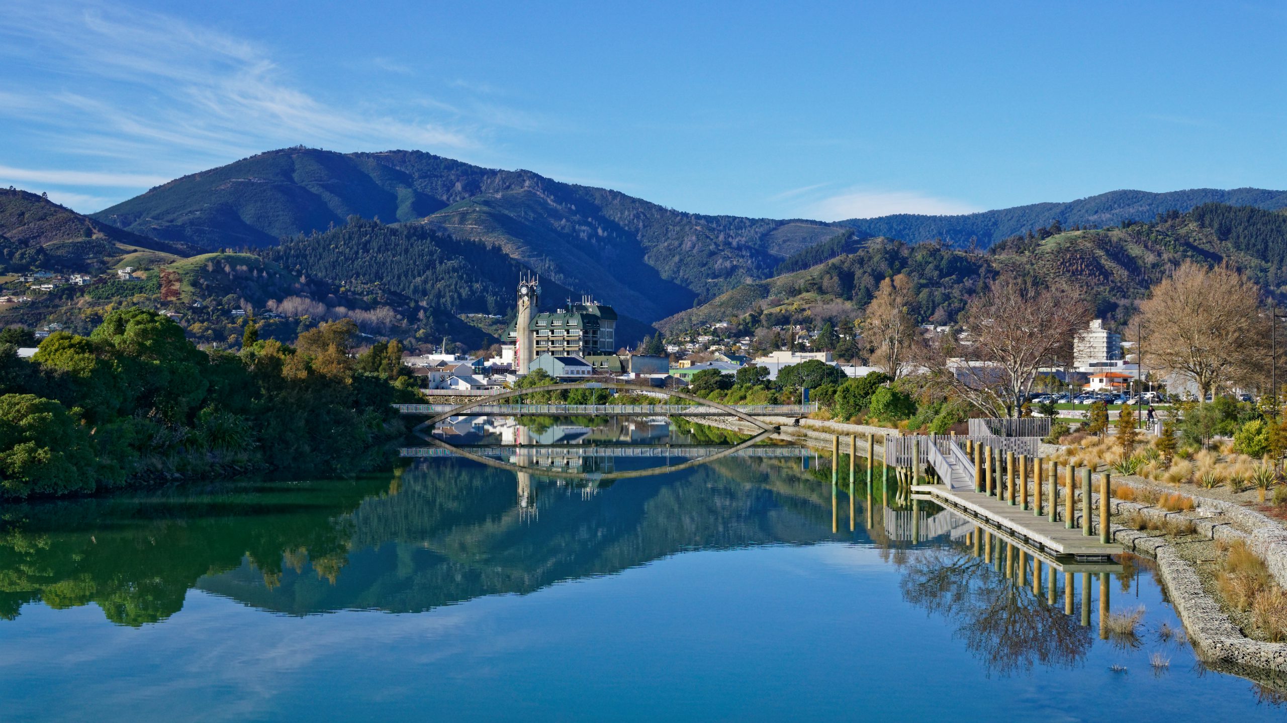 Panorama of Nelson City, reflected in the Maitai River, New Zealand.