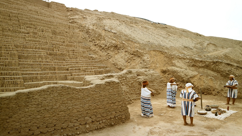 Wax figures of ancient people paying tribute to the gods in Huaca Pucllana pre Inca ruins in Miraflores district, Archaeological site in Lima, Peru