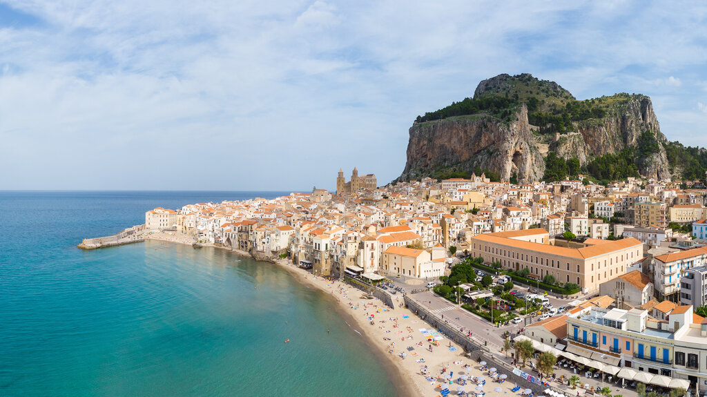 Panorama of the Celafu medieval old town and beach in SIcily, Italy